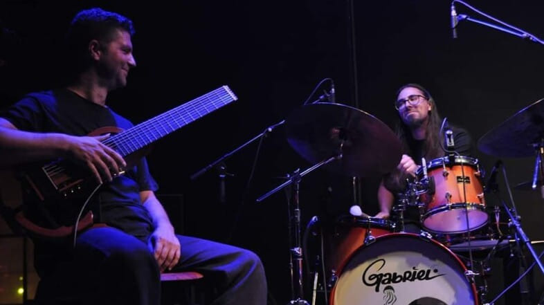 PolyMorΦia Duo for 8 string guitar & drums