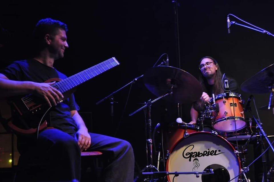 PolyMorΦia Duo for 8 string guitar & drums